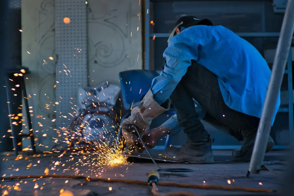 Learner doing practical metalwork during a welding course at Wheelset Academy welding training centre, preparing for welding trade test