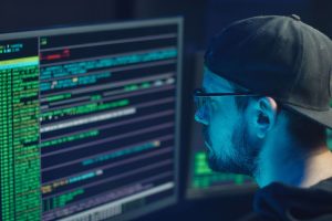 Cybersecurity Analyst Course learner monitoring cyber threats and analysing security incidents in a modern security operations centre