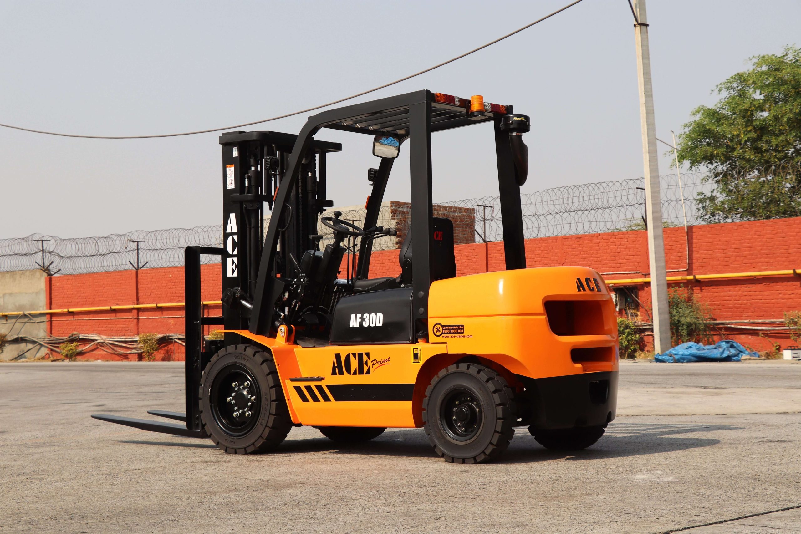 VNA Lift Truck F13 Driver operating a very narrow aisle forklift in a modern warehouse environment during material handling operations.