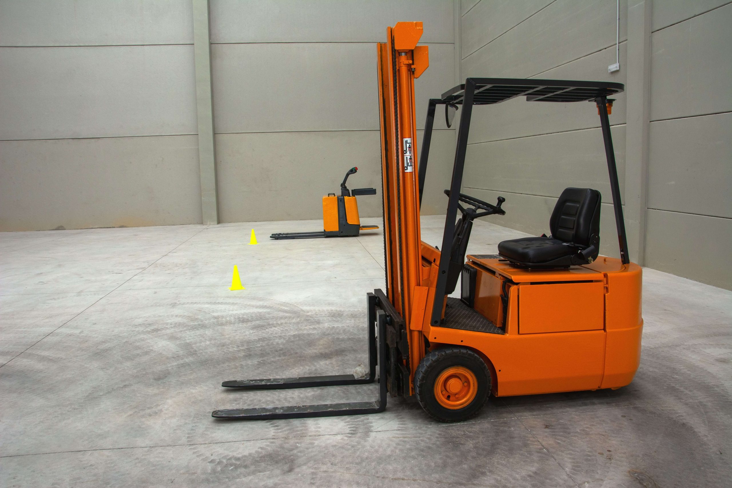 VNA Lift Truck F14 Driver operating a very narrow aisle forklift in a high-racking warehouse during material handling operations.