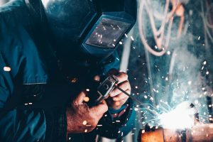 Coded welding learner producing a positional weld at Wheelset Academy