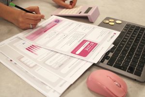 Payroll Manager learner reviewing employee payroll records during a Wheelset Academy payroll training session